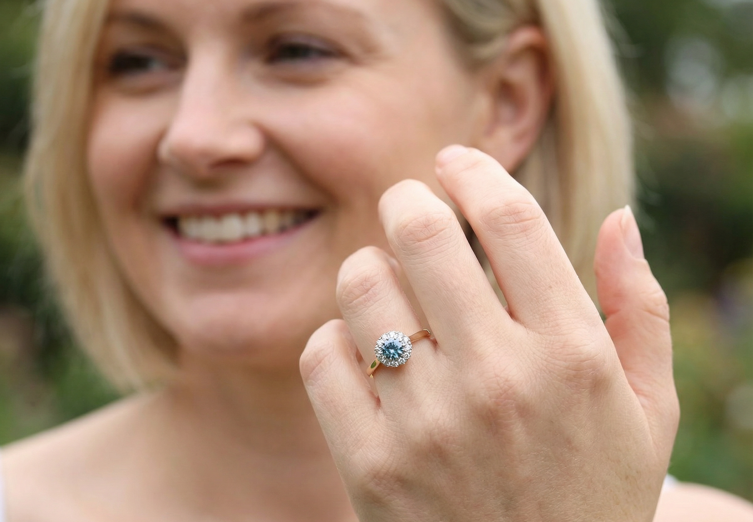 model fine vintage cluster ring. The centre stone a natural blue zircon, 7mm diameter, bright sparkling refraction to the sky blue hue. 