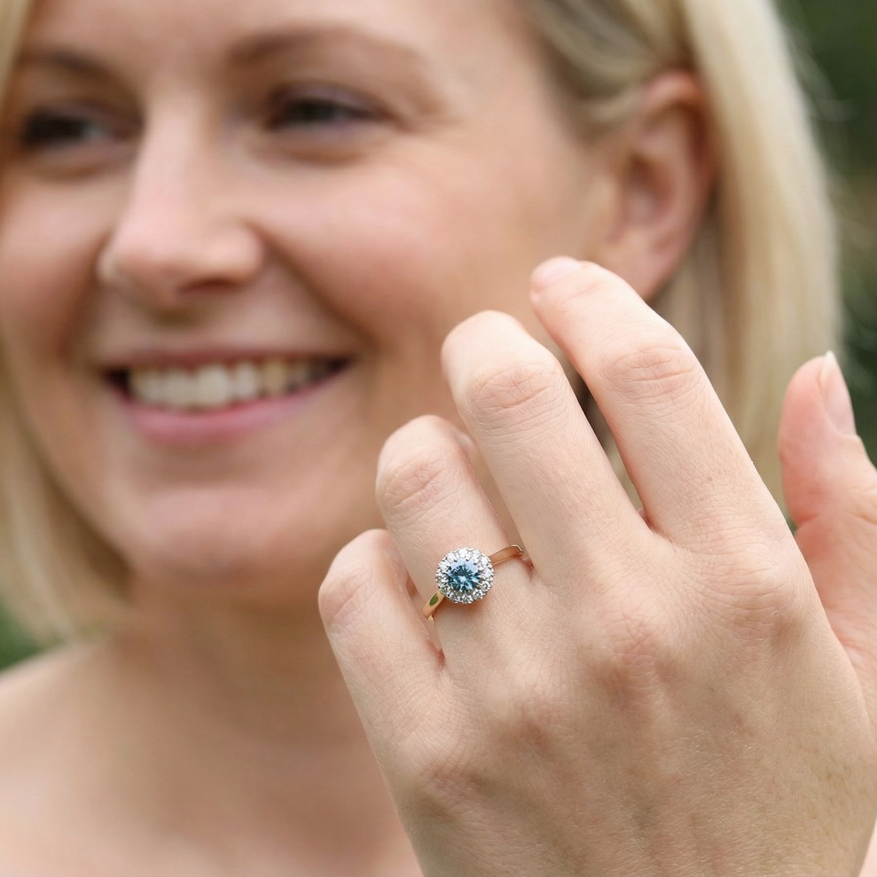 model fine vintage cluster ring. The centre stone a natural blue zircon, 7mm diameter, bright sparkling refraction to the sky blue hue. 