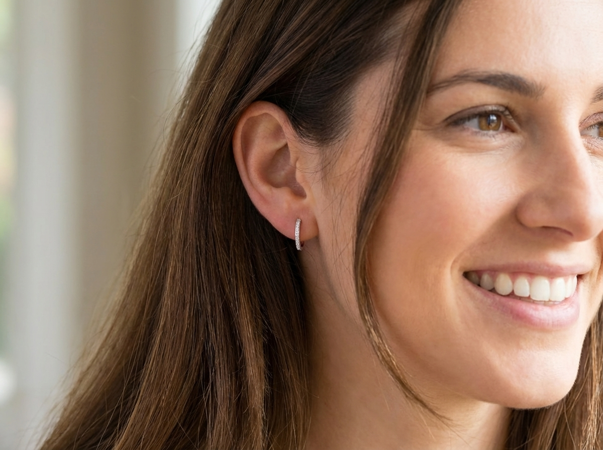 model hoop earrings by Mappin & Webb,