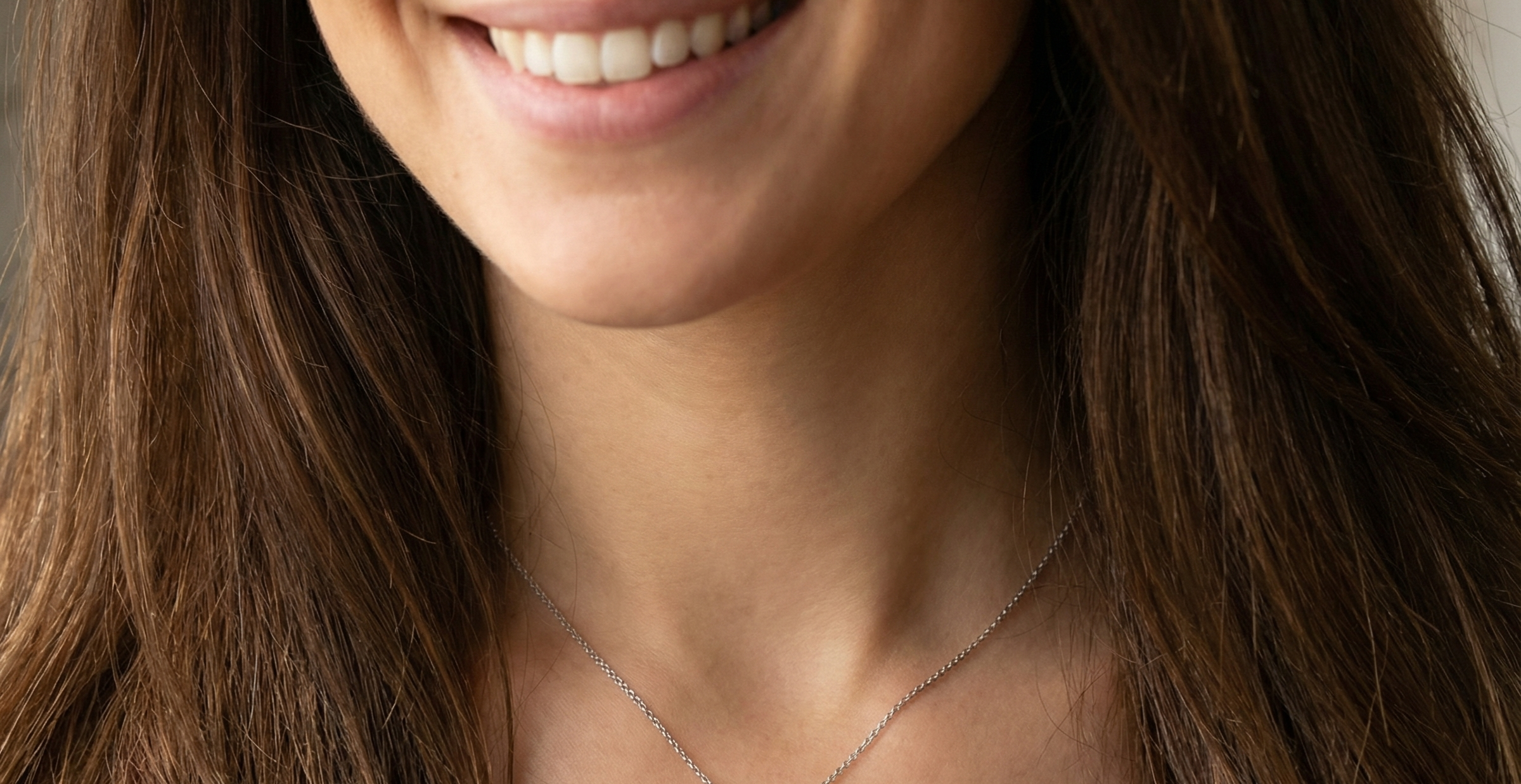 model pendant with a vibrant blue sapphire at its centre.