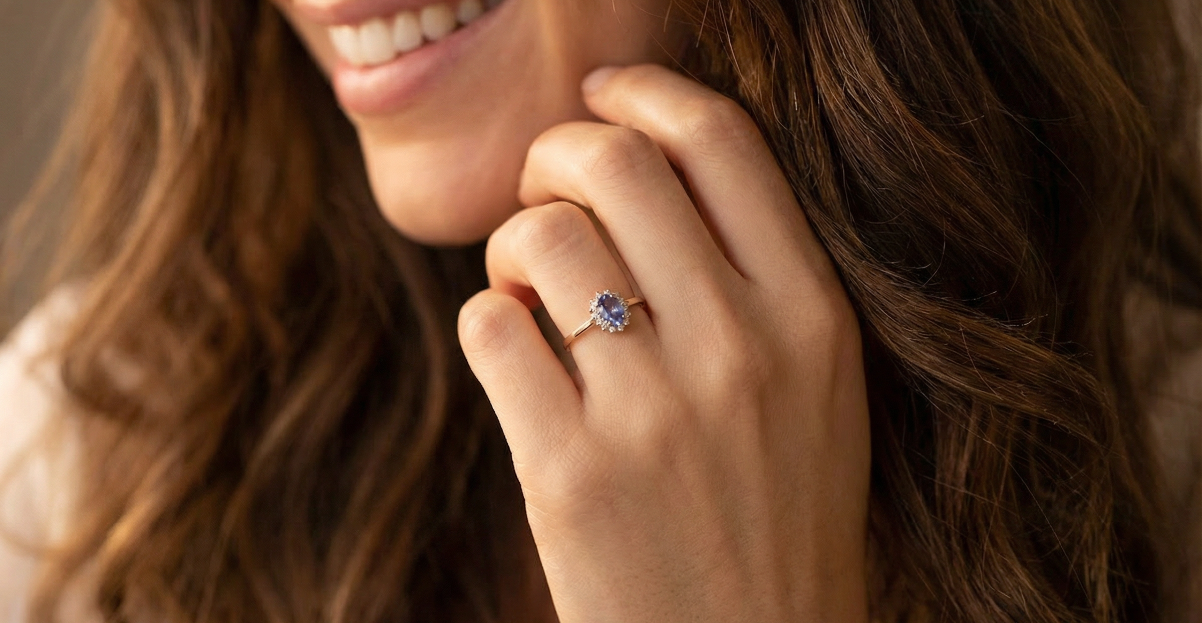 model pretty cluster ring that features an oval cut tanzanite gemstone,