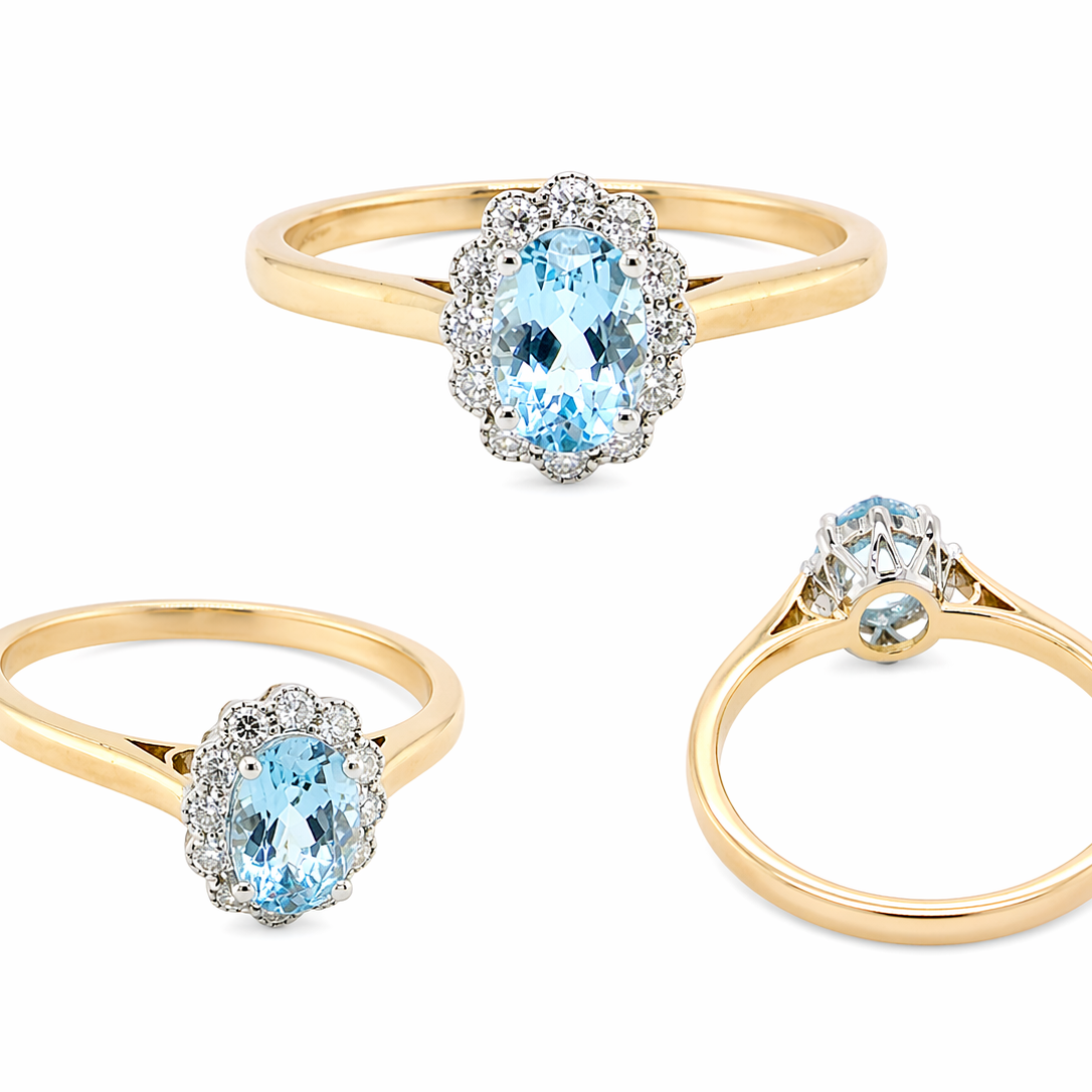 multi An 18 carat gold cluster ring. Set to the centre a lovely ice blue aquamarine 6x4mm, claw set.