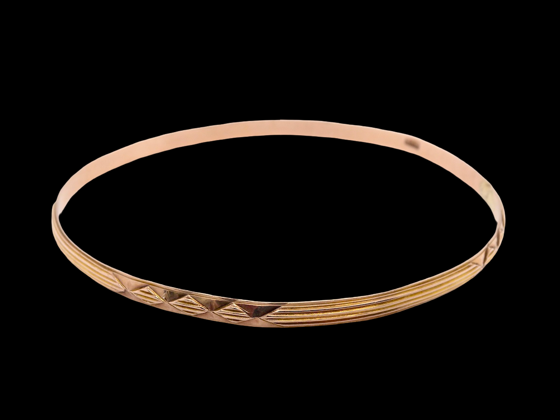 narrow gold bangle patterned