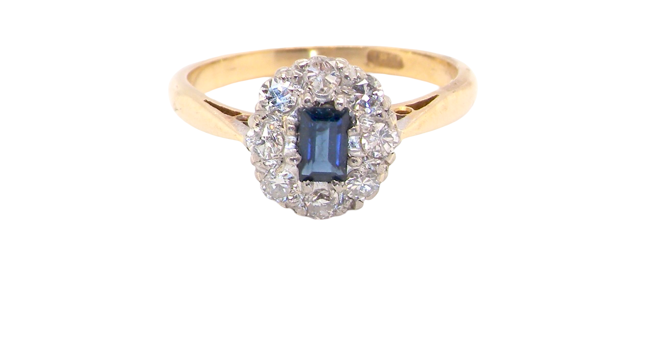 1970s cluster ring featuring a rectangular-cut sapphire,