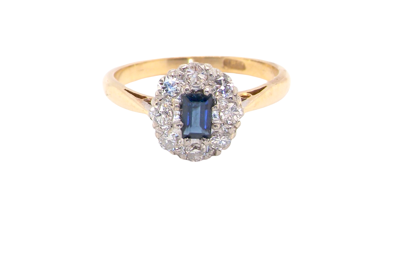 1970s cluster ring featuring a rectangular-cut sapphire,