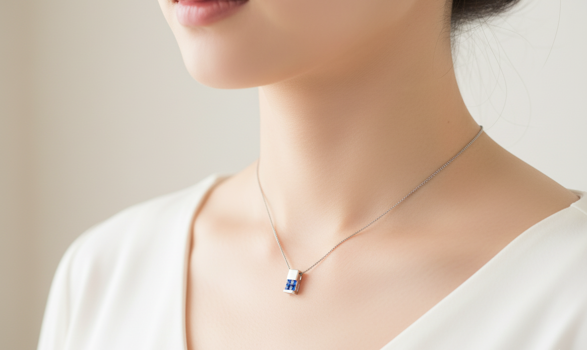 An 18 carat White Gold* Pendant with Sapphires