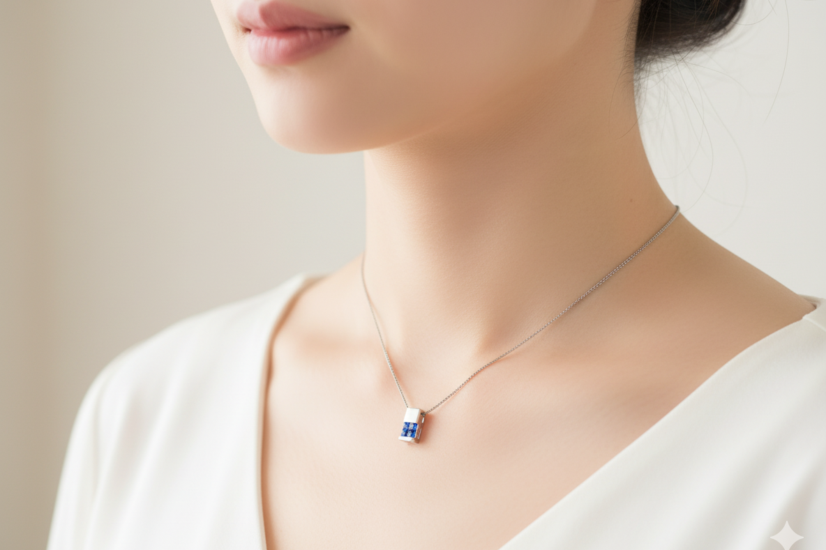 An 18 carat White Gold* Pendant with Sapphires