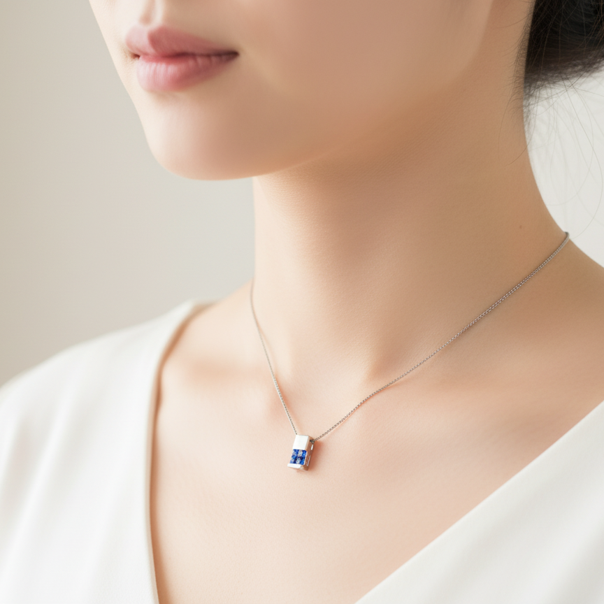An 18 carat White Gold* Pendant with Sapphires