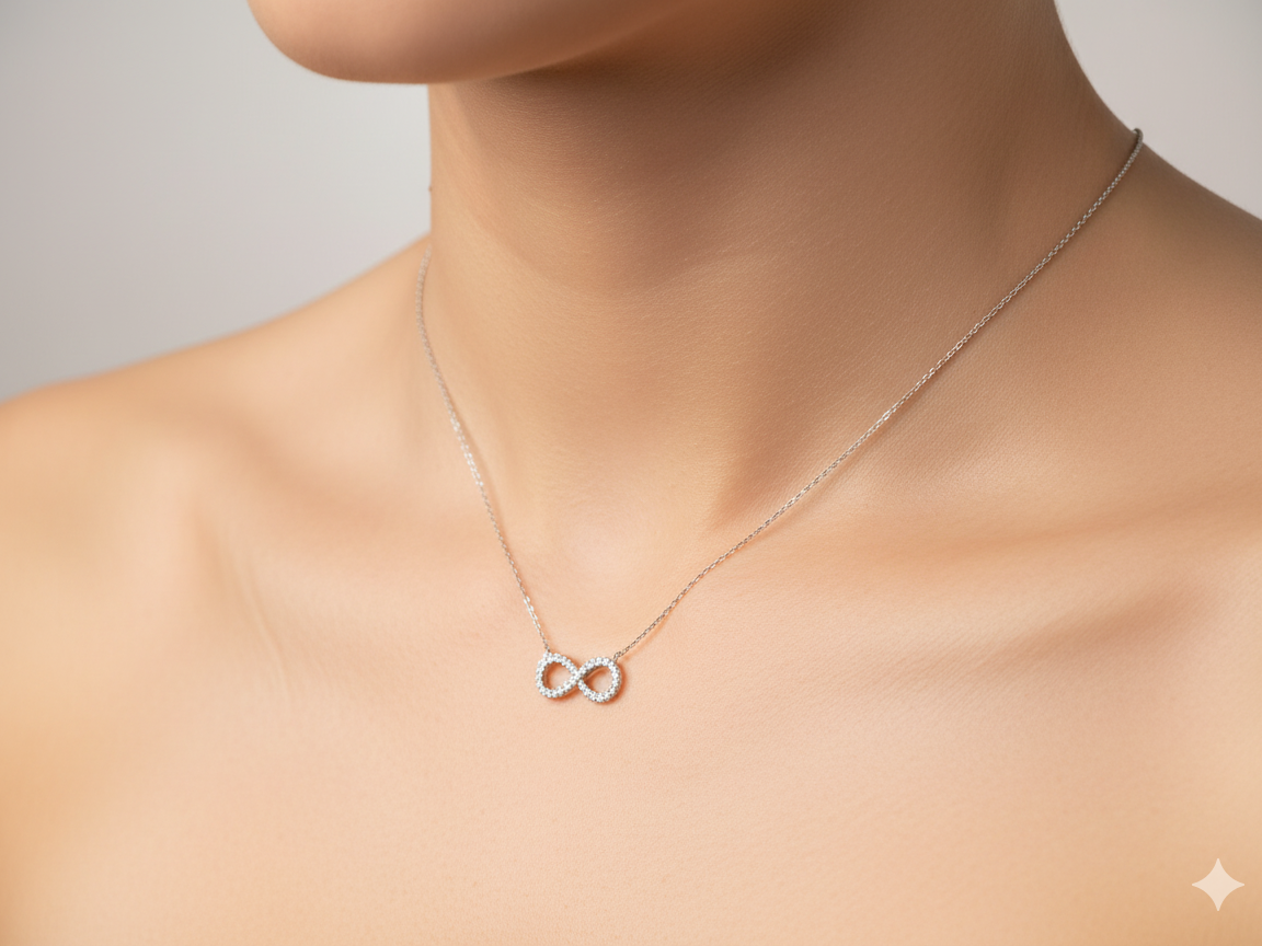 An 18 carat white gold Diamond 'Infinity' pendant