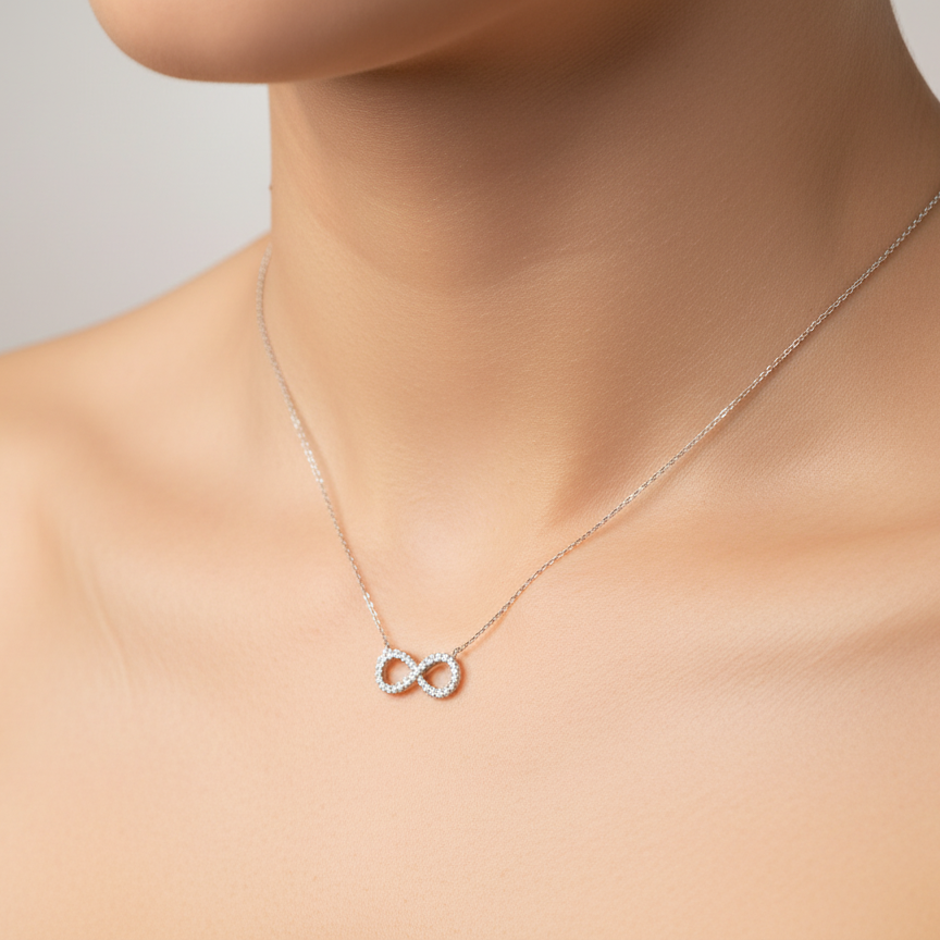 An 18 carat white gold Diamond 'Infinity' pendant