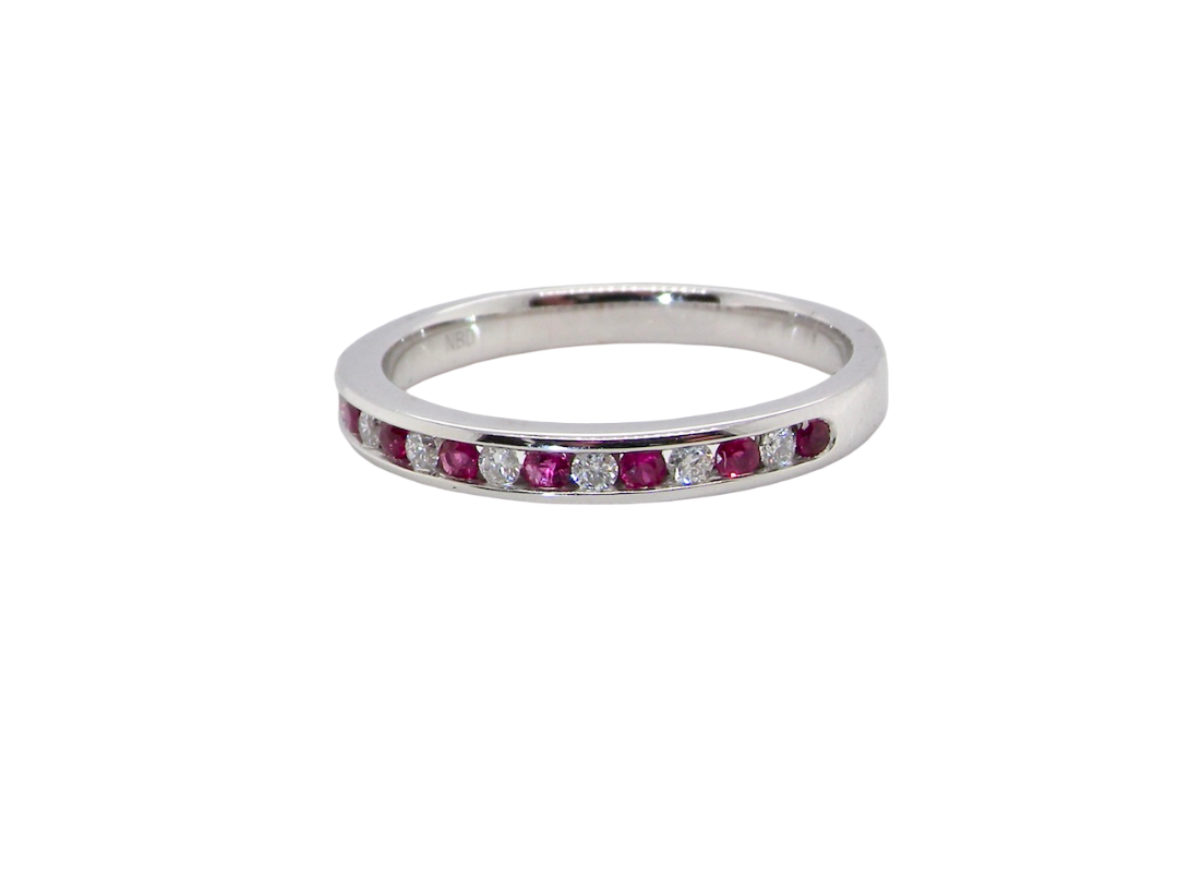 new A white gold half hoop eternity ring. Set with seven round rubies and six brilliant cut white diamonds