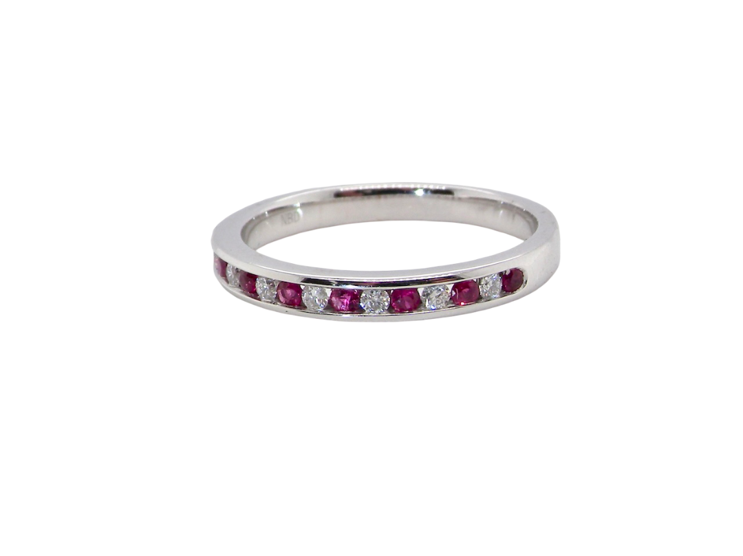 new A white gold half hoop eternity ring. Set with seven round rubies and six brilliant cut white diamonds