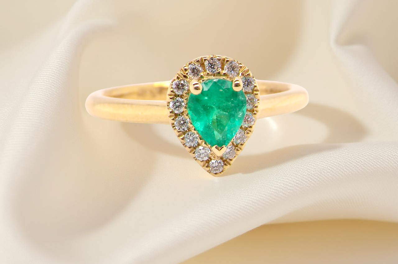 A new pear shaped Emerald and Diamond ring
