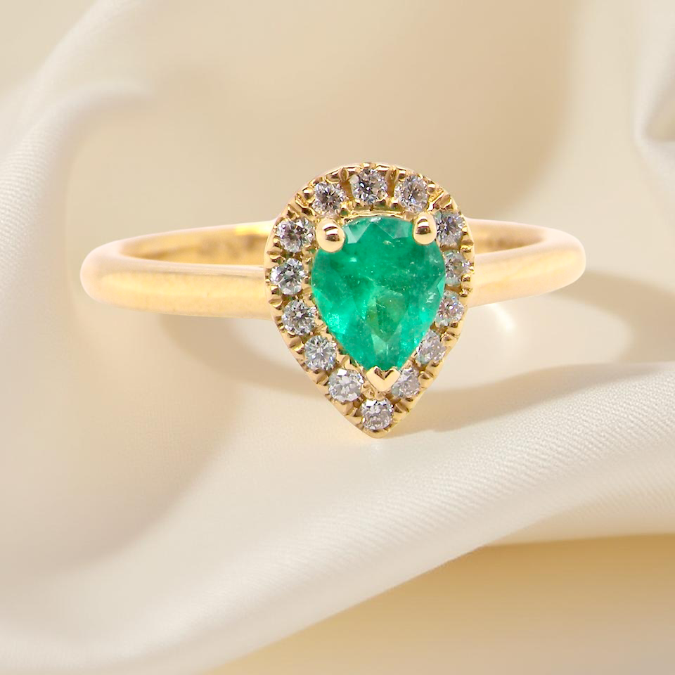 A new pear shaped Emerald and Diamond ring