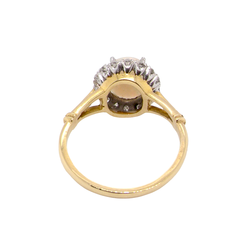 opal A vintage cluster ring. Features an oval white opal, measures 10x8mm, with a good play of colour.