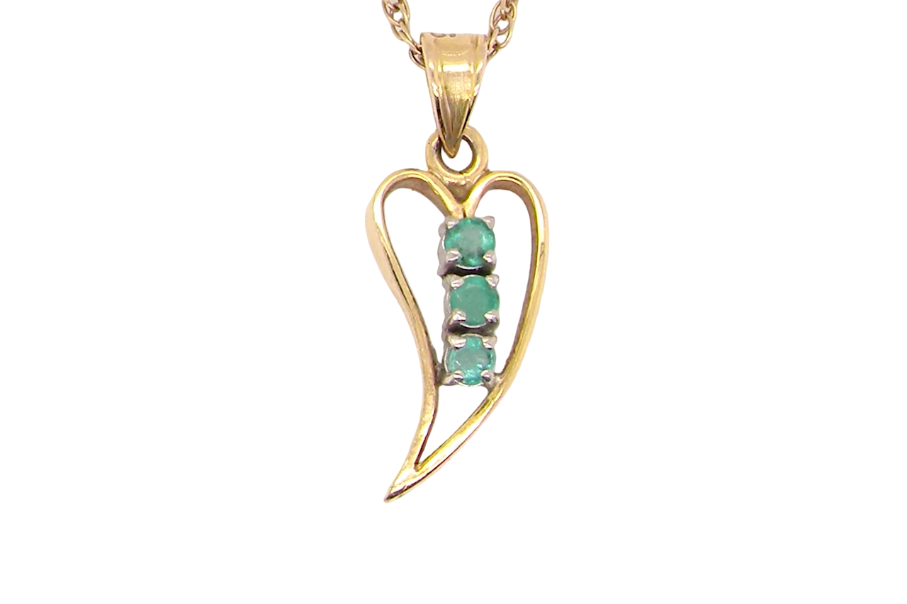 open-heart pendant,set with three emeralds,
