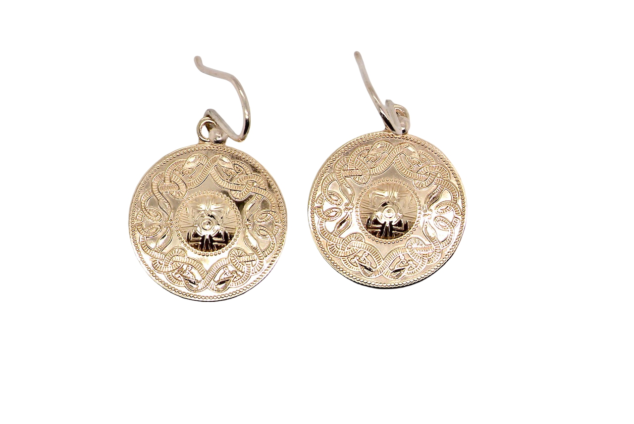 A pair of disc shaped earrings