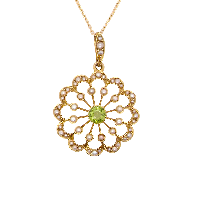 pendant from the Edwardian- Age of Elegance-
The centre stone- a round peridot 5mm diameter, mille grain set. A satellite perimeter of twelve seed pearls, each 2.4mm. The outside border is scalloped shaped