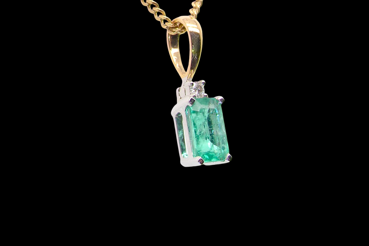 pendant set with a rectangular emerald