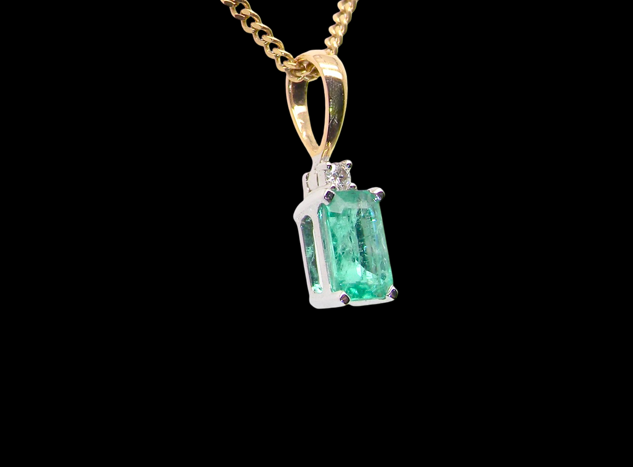 pendant set with a rectangular emerald