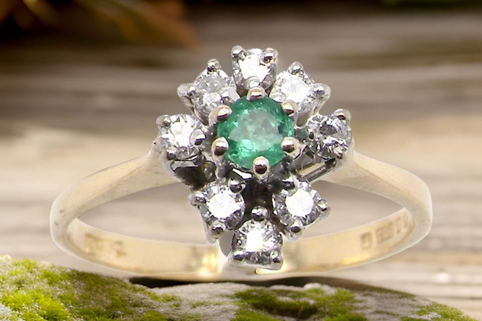 An Emerald and Diamond Ring