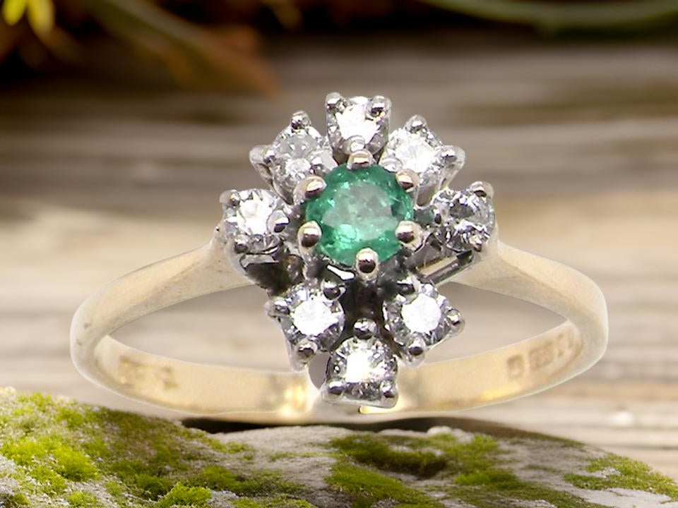 An Emerald and Diamond  Ring