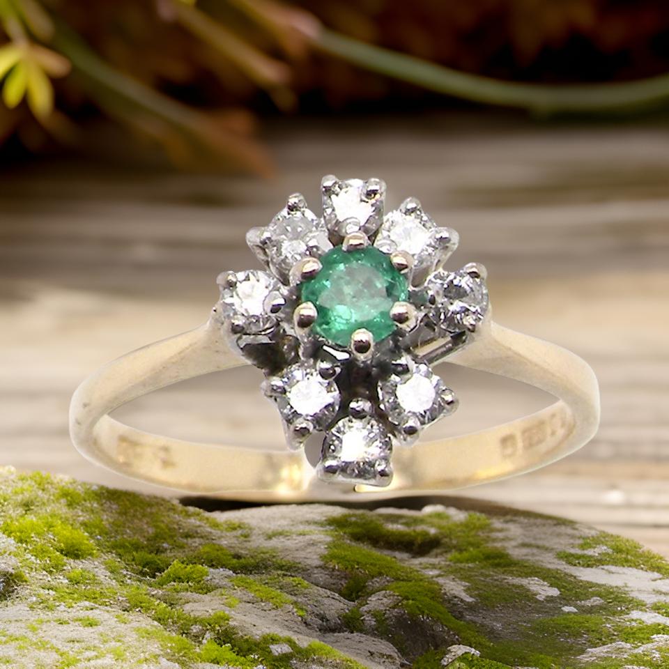 An Emerald and Diamond Ring