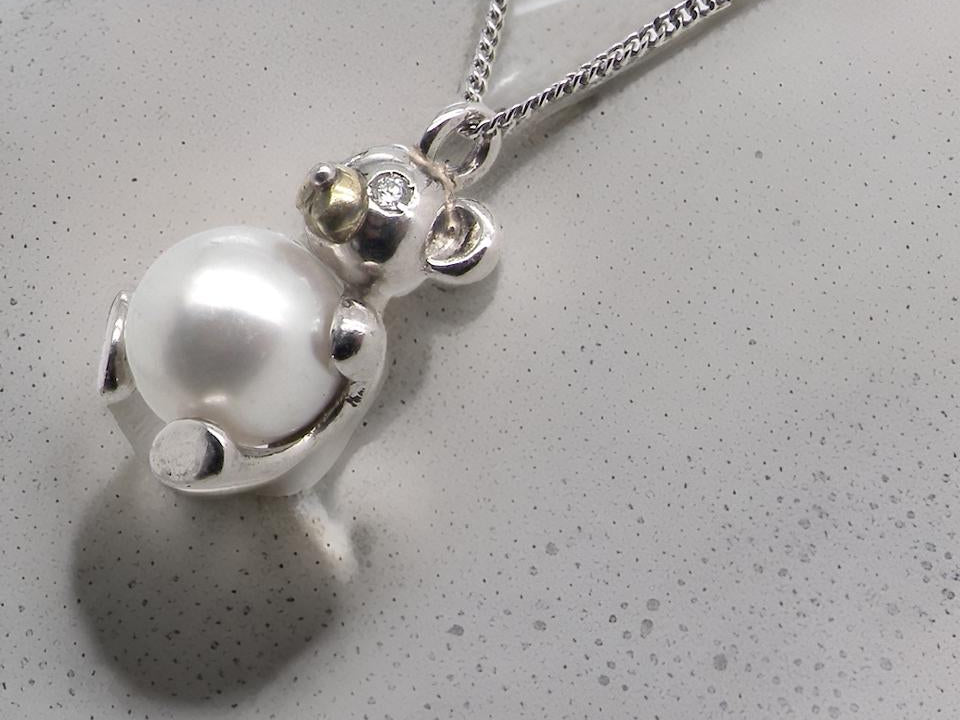 A Teddy Bear platinum pendant