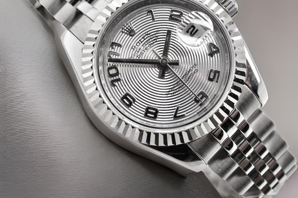 A womans steel Rolex wrist watch