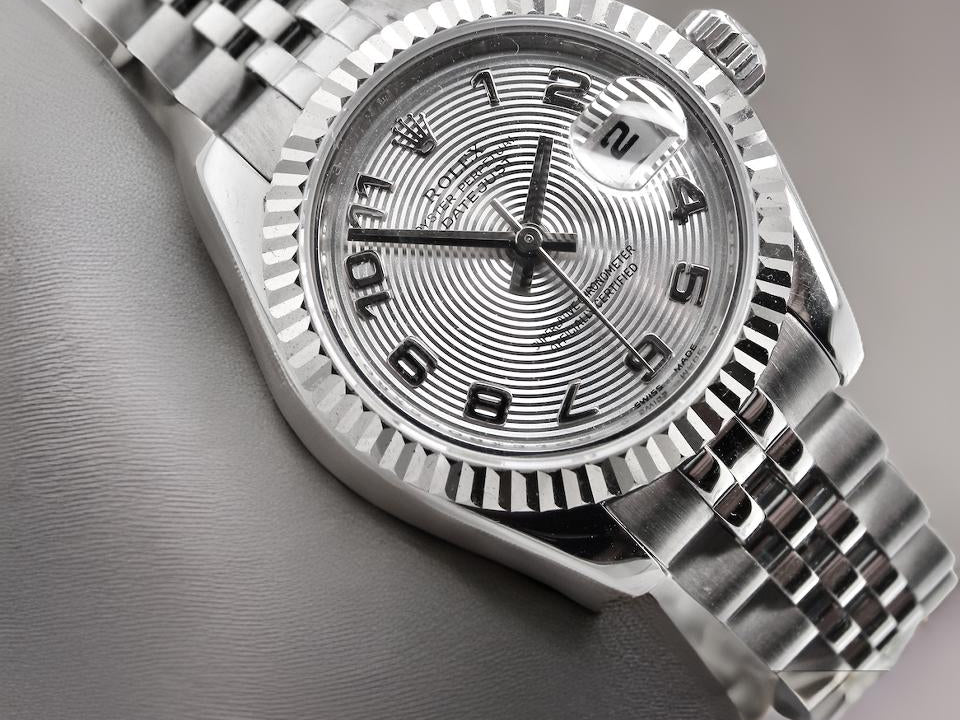 A womans steel Rolex wrist watch