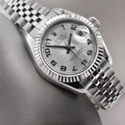 A womans steel Rolex wrist watch