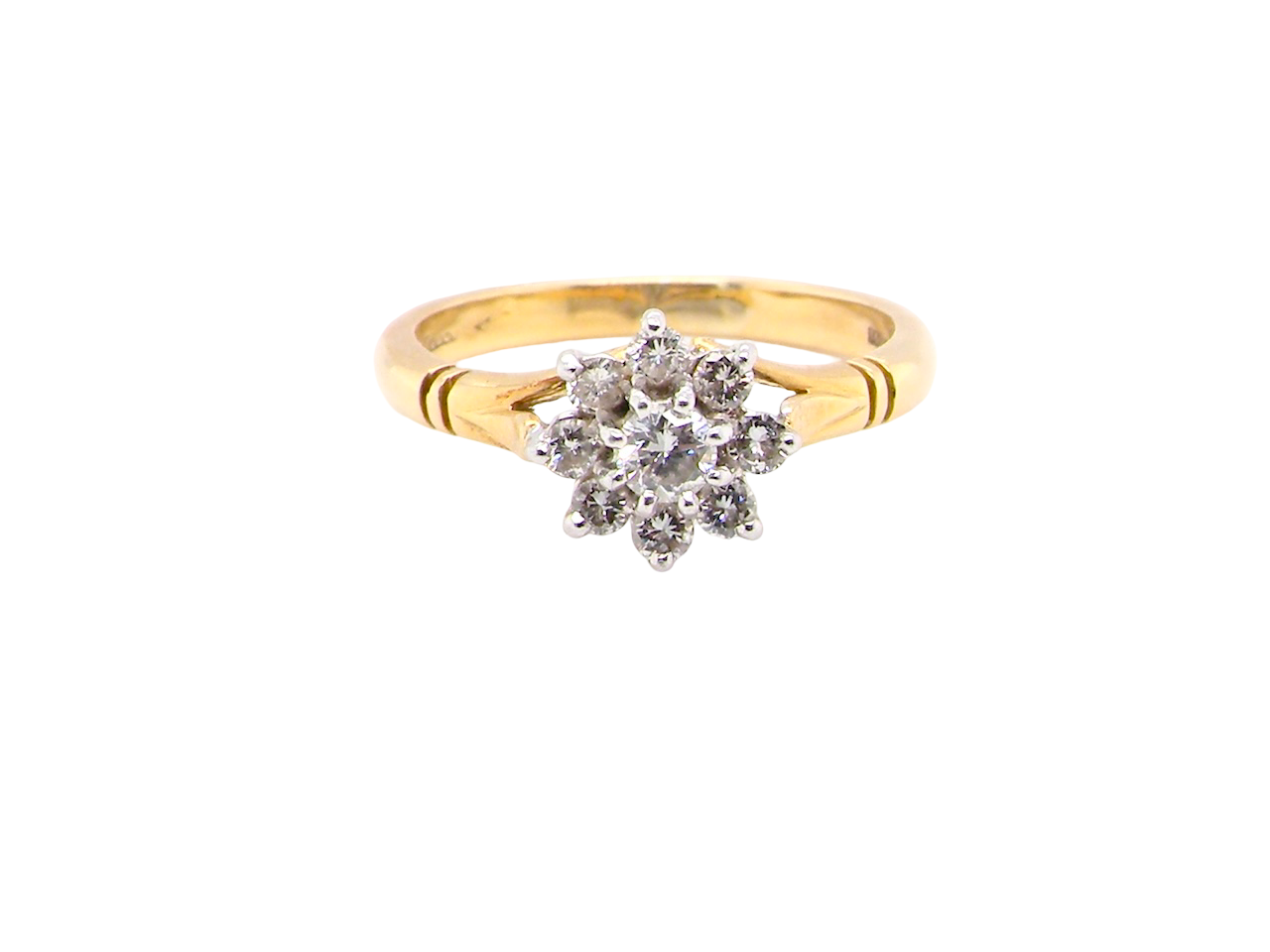 pretty cluster ring set with nine brilliant-cut white diamonds.