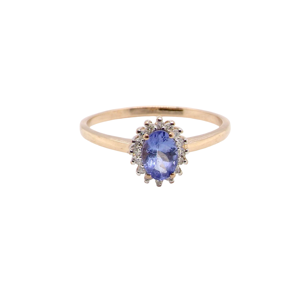 pretty cluster ring that features an oval cut tanzanite gemstone,