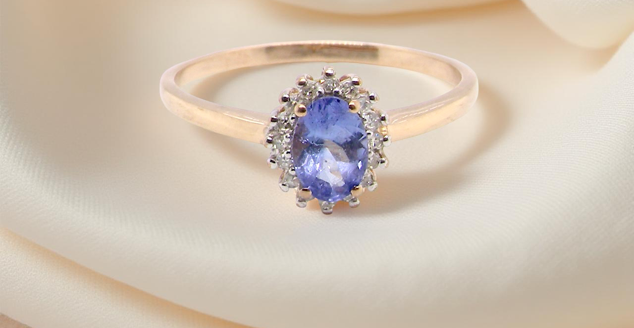pretty cluster ring with an oval cut tanzanite gemstone,