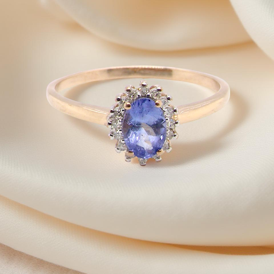 pretty cluster ring with an oval cut tanzanite gemstone,