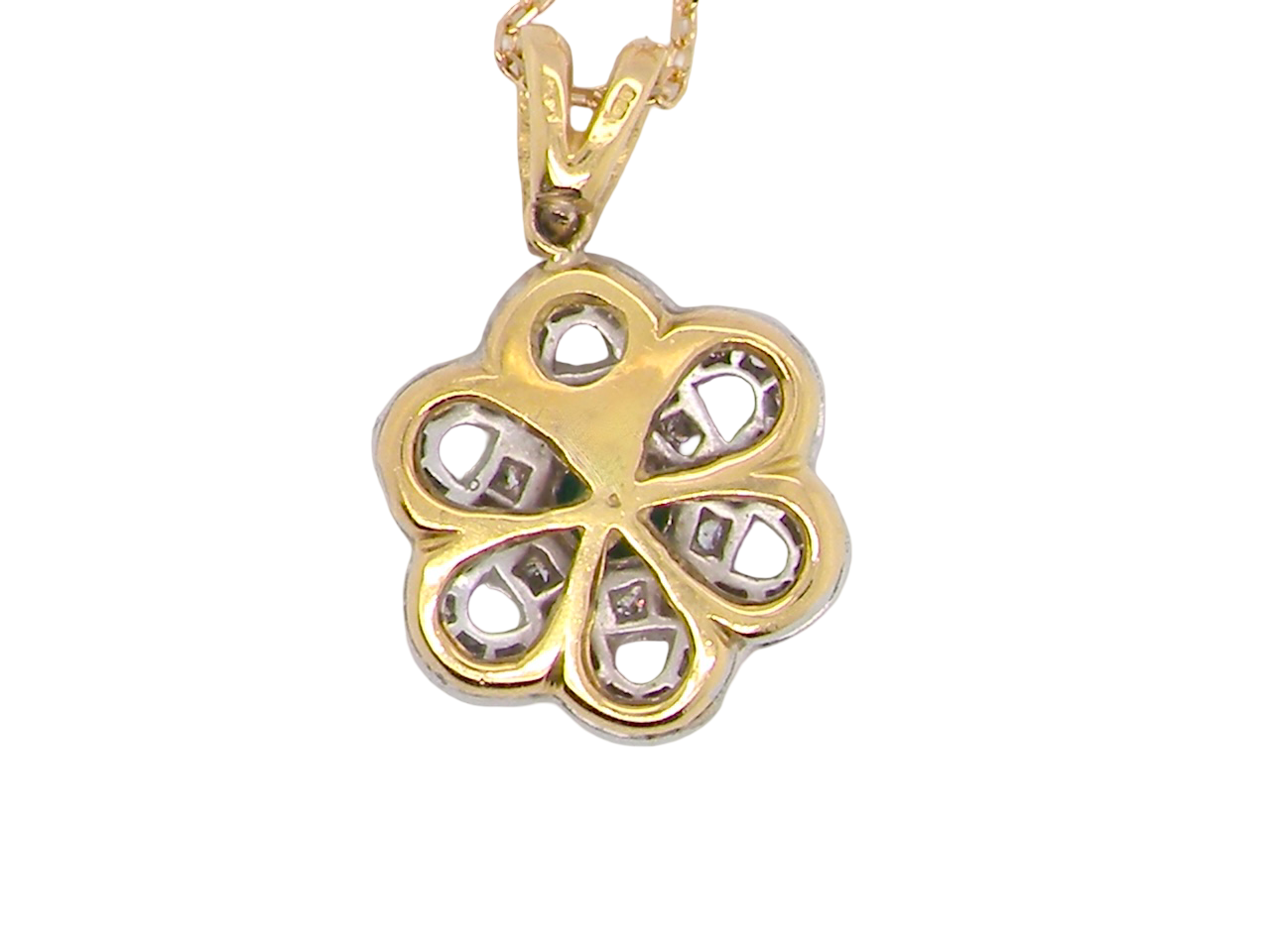 rear 8 carat gold pendant that features to the centre a round emerald