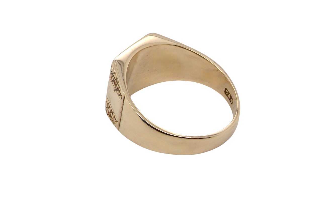 rear A 1970s gentleman's 9 carat gold signet ring.
