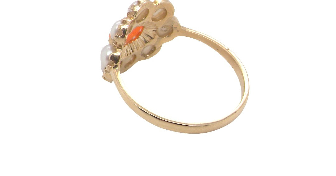 rear A 9 carat gold cluster ring. Centre stone an oval shaped coral stone 6x4mm.
