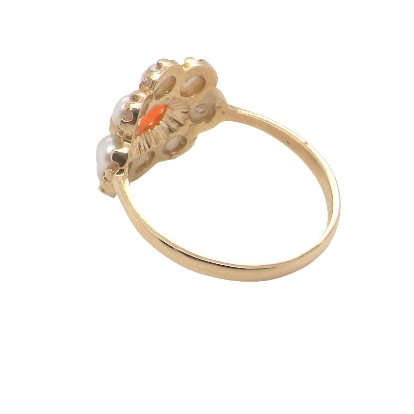 rear A 9 carat gold cluster ring. Centre stone an oval shaped coral stone 6x4mm.