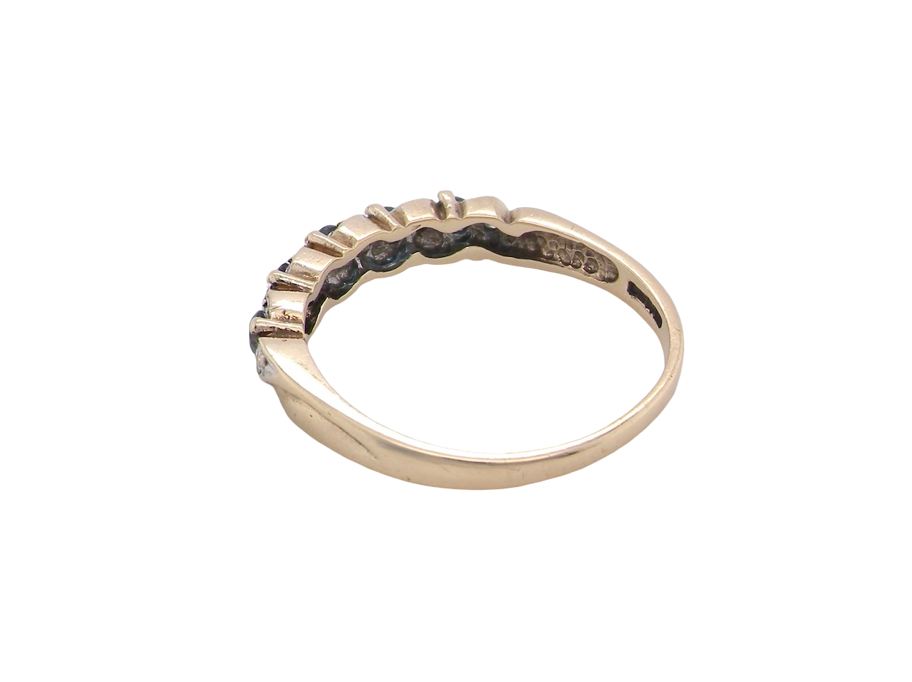 rear A 9 carat gold half hoop eternity ring. Set with five blue topaz gem stones, each 2.8mm. 