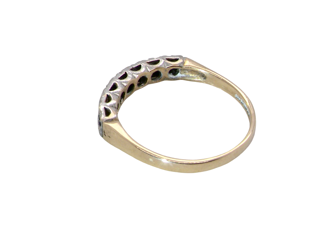 rear A 9 carat gold half hoop eternity ring. Set with four sapphires, each 2.4mm, and between each a 1mm illusion set diamond.