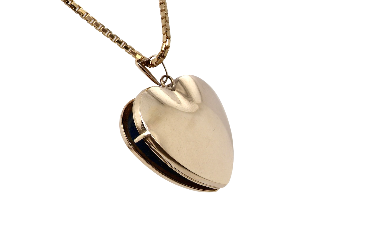 A 9 carat gold heart shaped locket. 25x25mm, part hand engraved front, plain reverse