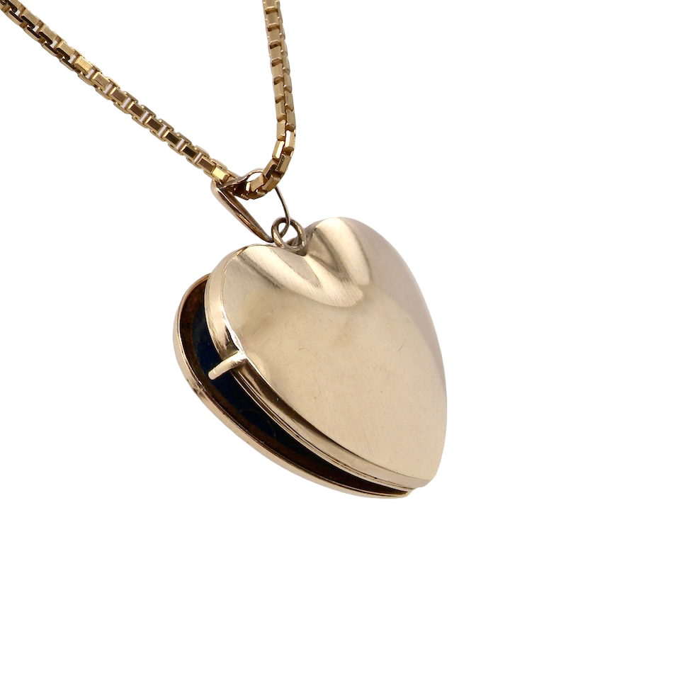 A 9 carat gold heart shaped locket. 25x25mm, part hand engraved front, plain reverse