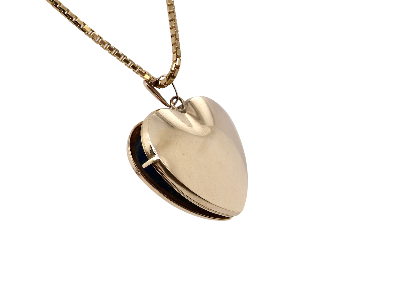 A 9 carat gold heart shaped locket. 25x25mm, part hand engraved front, plain reverse