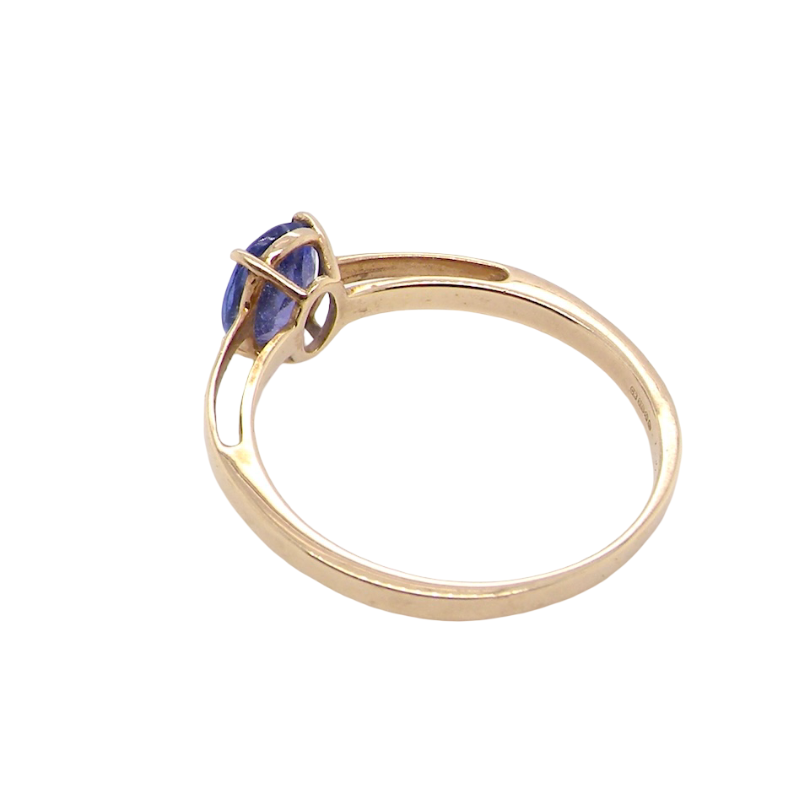 rear A 9 carat gold ring containing a single oval cut tanzanite gemstone. Measures 8x6mm, four claw setting.