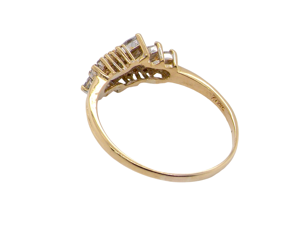 Gold ring with diamond accents on a white background