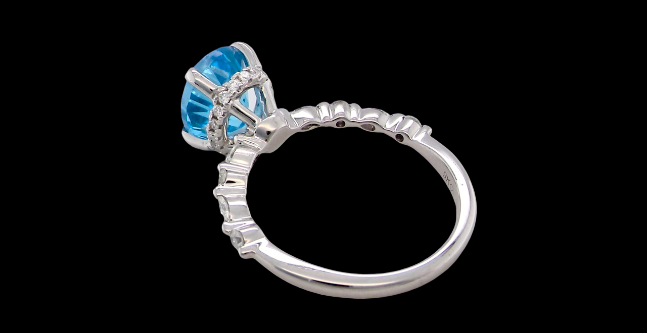 rear A NEW ring- but with a gemstone that we have taken from an old ring that was worn out, so its a new lease of life! The topaz measures 9x7mm.