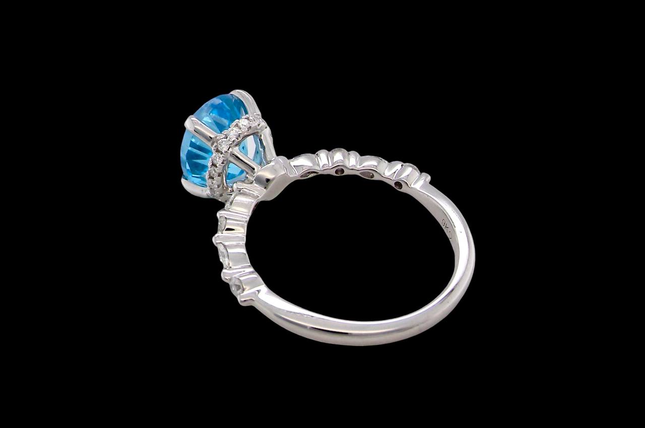 rear A NEW ring- but with a gemstone that we have taken from an old ring that was worn out, so its a new lease of life! The topaz measures 9x7mm.