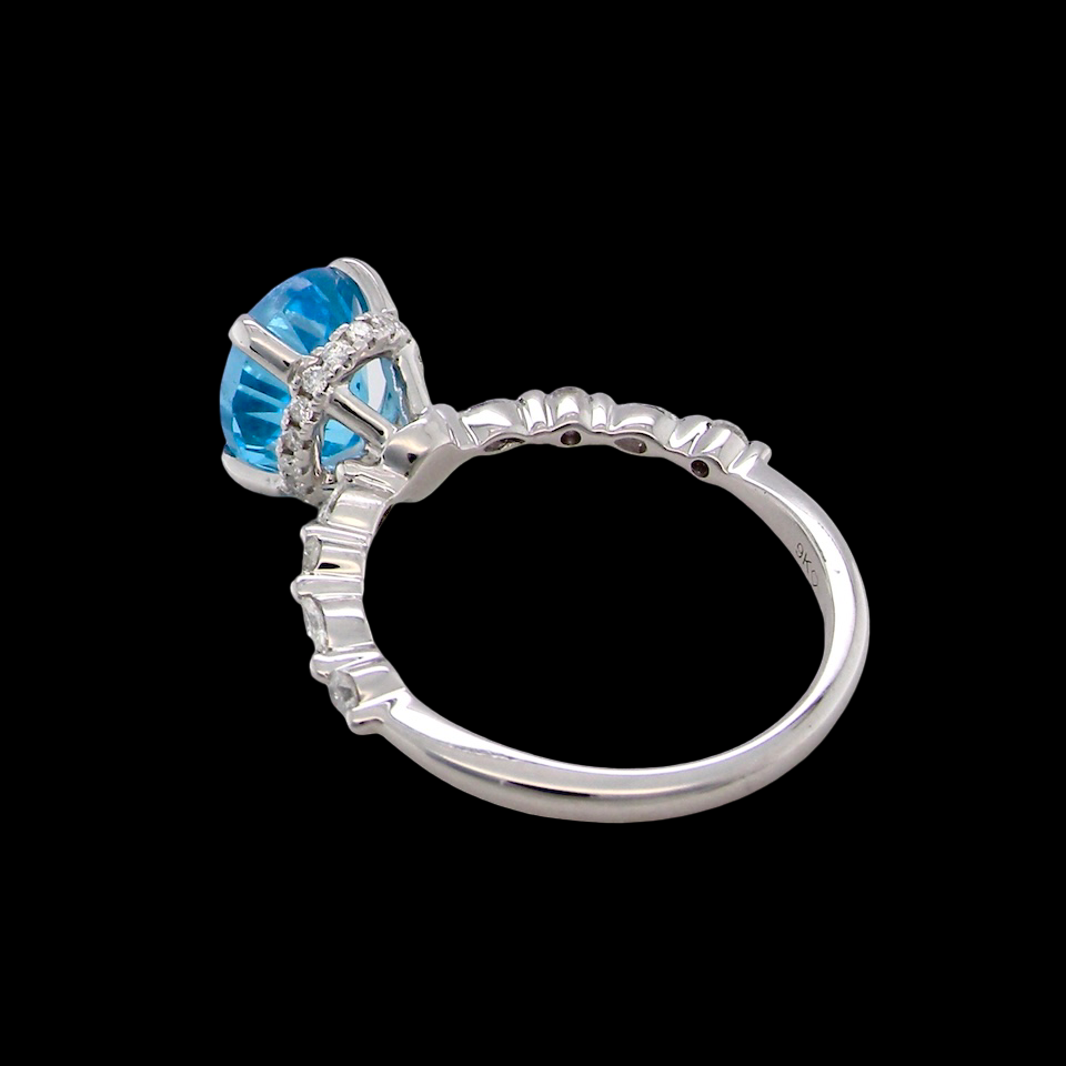 rear A NEW ring- but with a gemstone that we have taken from an old ring that was worn out, so its a new lease of life! The topaz measures 9x7mm.