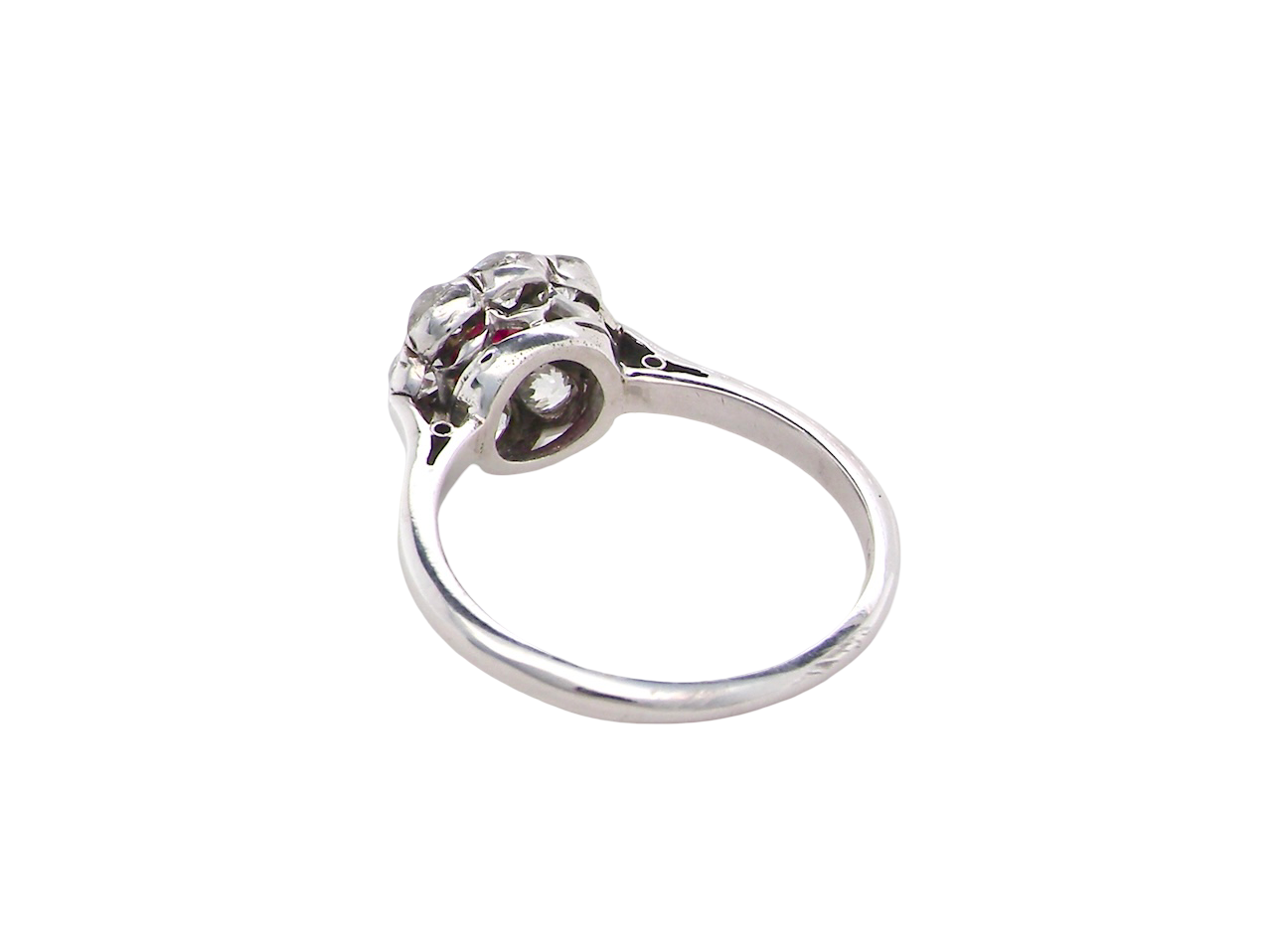 rear A beautiful cluster ring set with a raspberry-red ruby centre stone measuring 5mm in diameter, estimated at approximately 0.50 carats.
